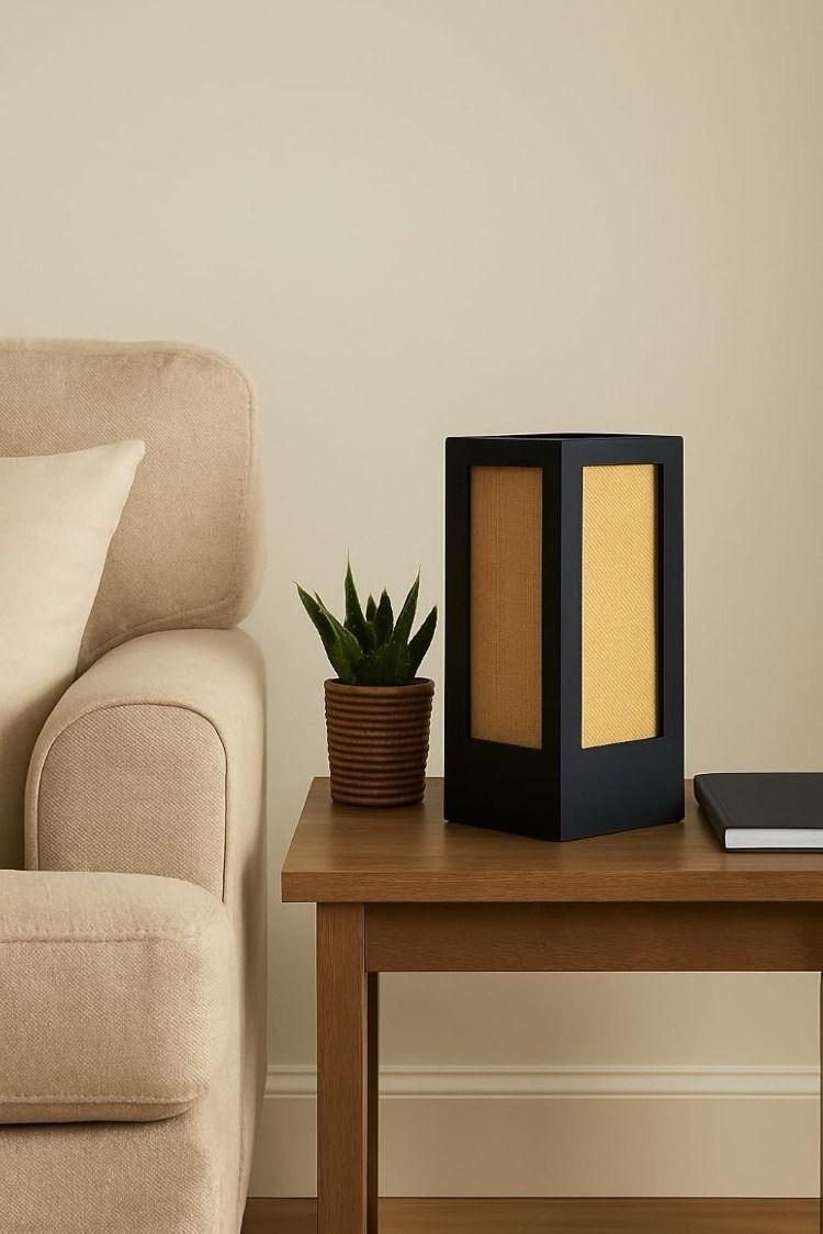 Warm lit table lamp on living room side table